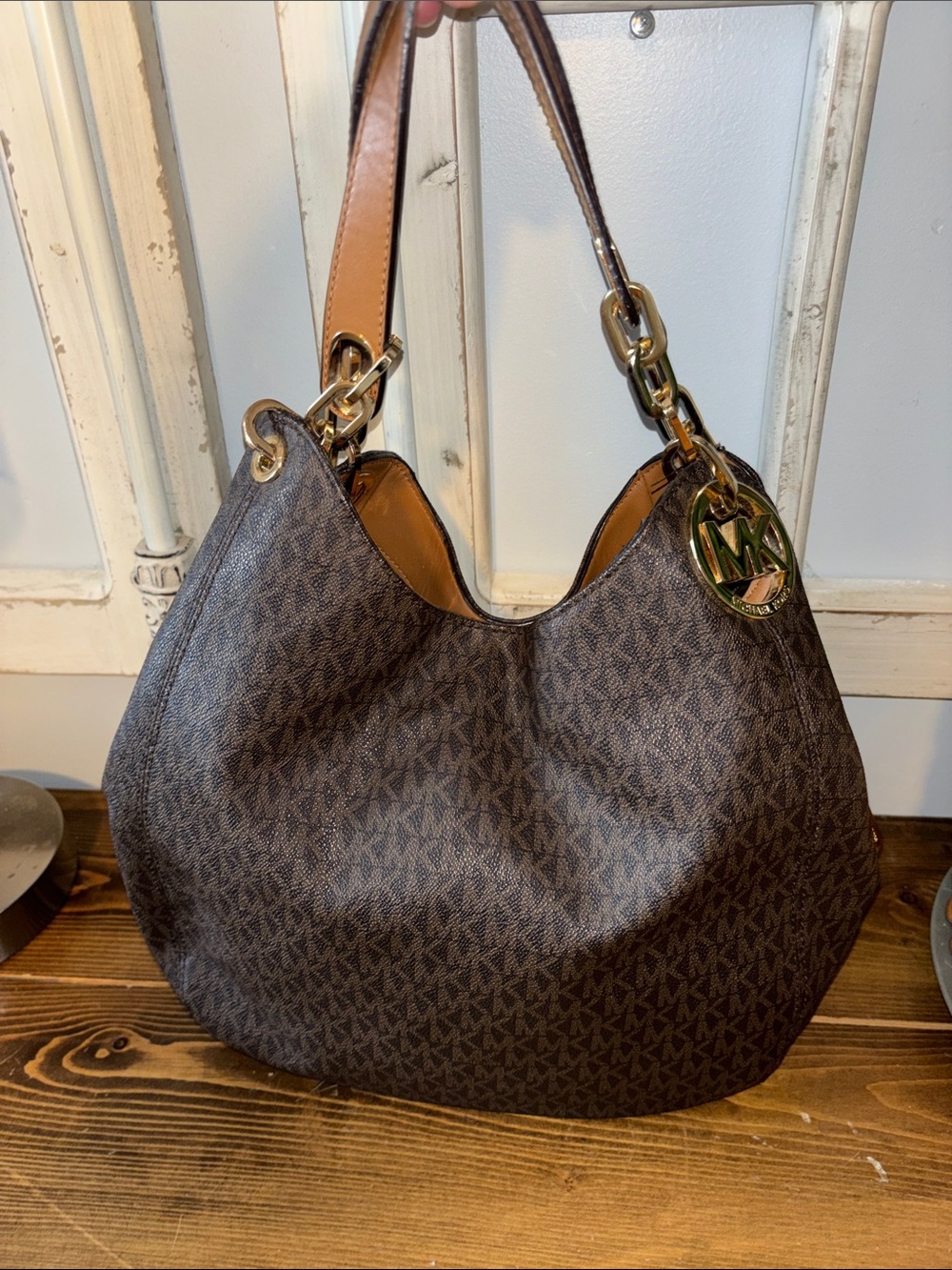 Michael Kors Dark Brown Monogram Hobo with Gold Hardware. Excellent condition